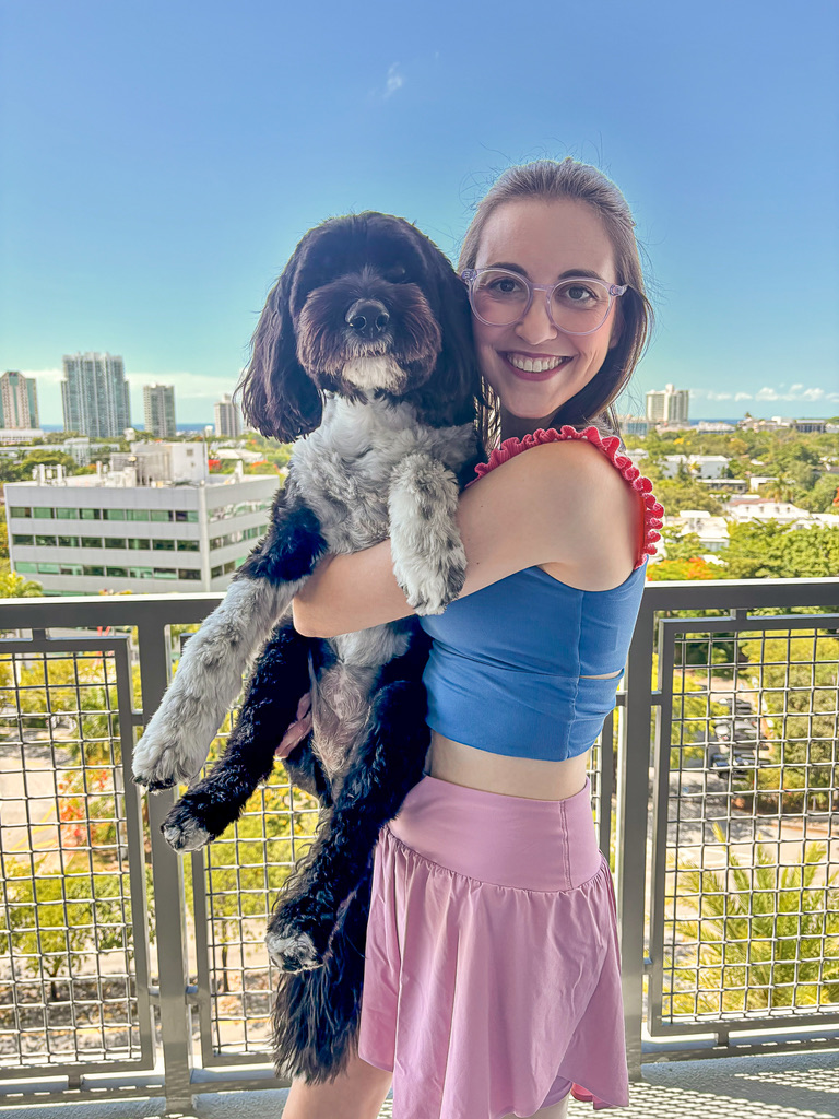 Carley holding Chloe on the balcony